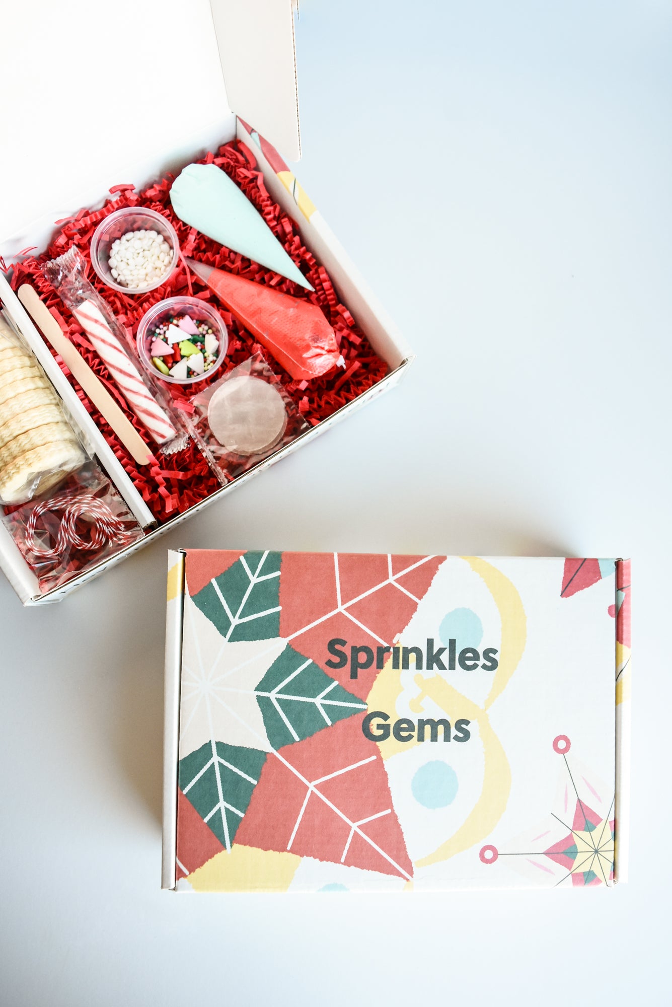Holiday-themed Cookie Decorating Kit with pre-baked cookies and colorful frostings